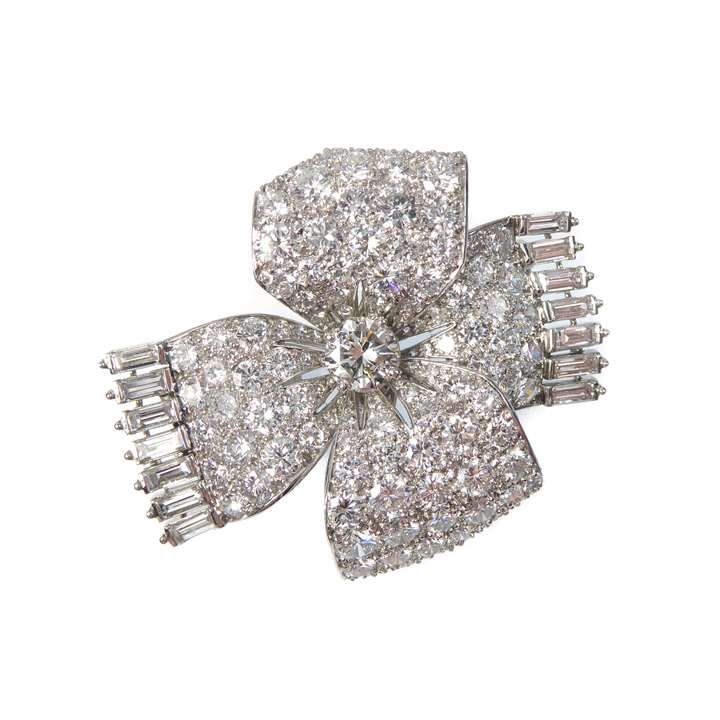 Diamond ribbon tied bow brooch with baguette fringes